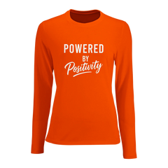 Women's fitted long sleeve t-shirt in orange with "Powered by Positivity" motivational text design