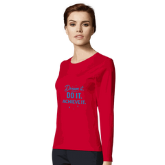 Woman wearing a red fitted women's motivational long sleeve t-shirt with "Dream it. DO IT. ACHIEVE IT." text on the front