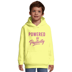 Child wearing a yellow motivational recycled blend kids hoodie with "Powered by Positivity" text