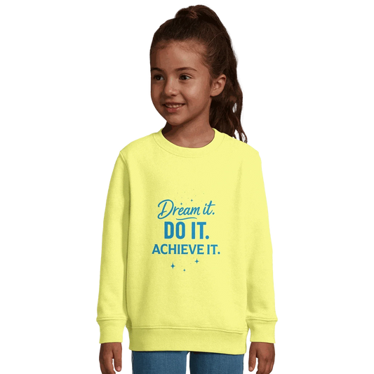 Child wearing yellow recycled kids motivational sweatshirt with "Dream It. Do It. Achieve It." text