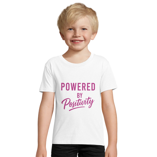 Smiling child wearing white motivational organic kids fitted t-shirt with "Powered by Positivity" text in purple