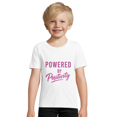 Smiling child wearing white motivational organic kids fitted t-shirt with "Powered by Positivity" text in purple
