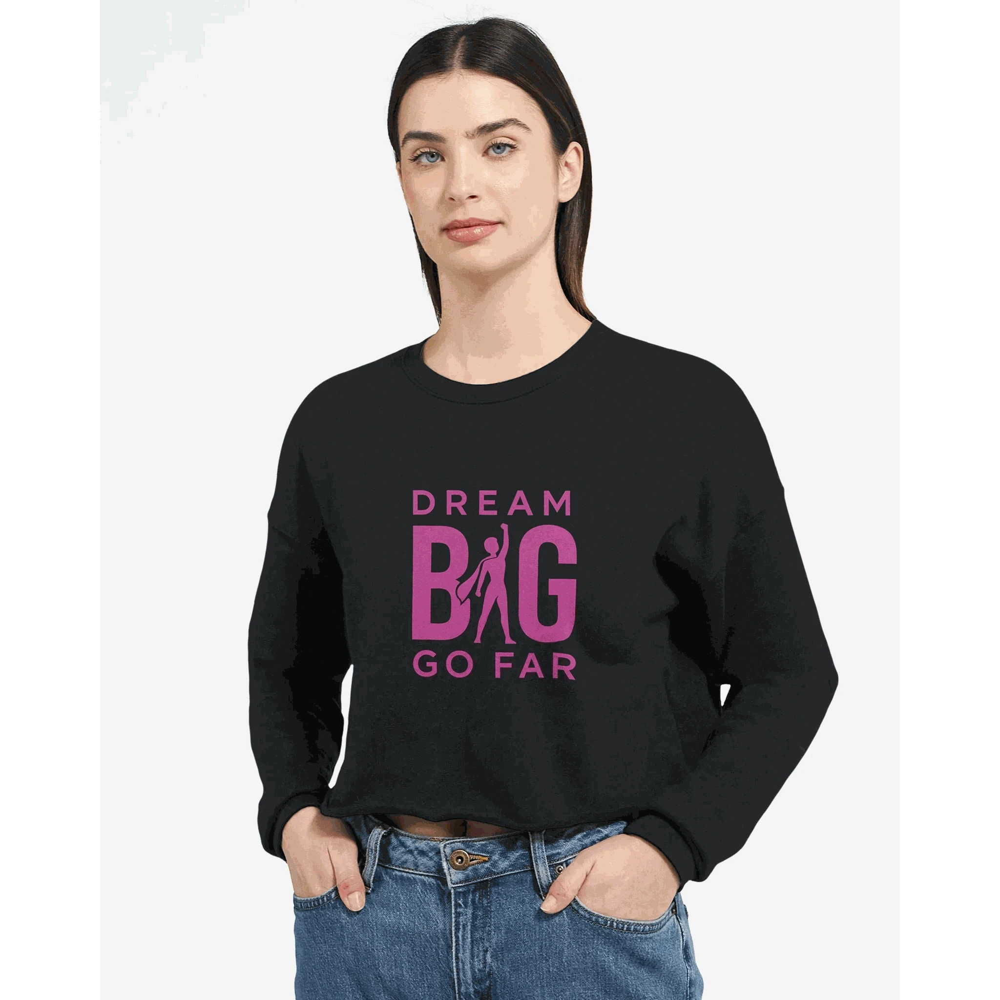 Dream BIG woman wearing black cropped sweatshirt with pink "Dream BIG Go Far" motivational text design