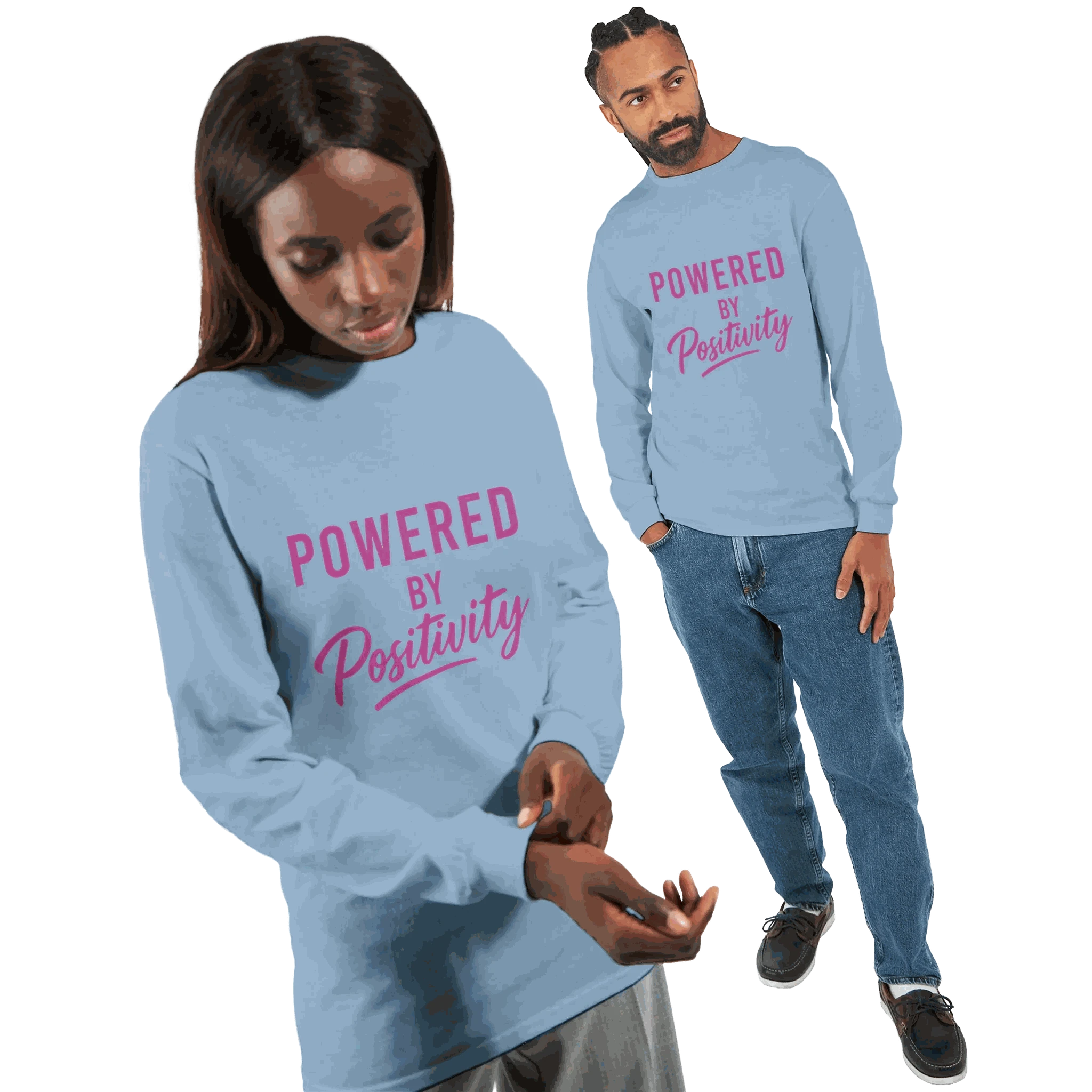 Unisex long sleeve t-shirt in light blue with "Powered by Positivity" motivational text in pink font