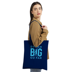 Woman carrying navy blue Dream BIG tote bag with motivational text and silhouette design