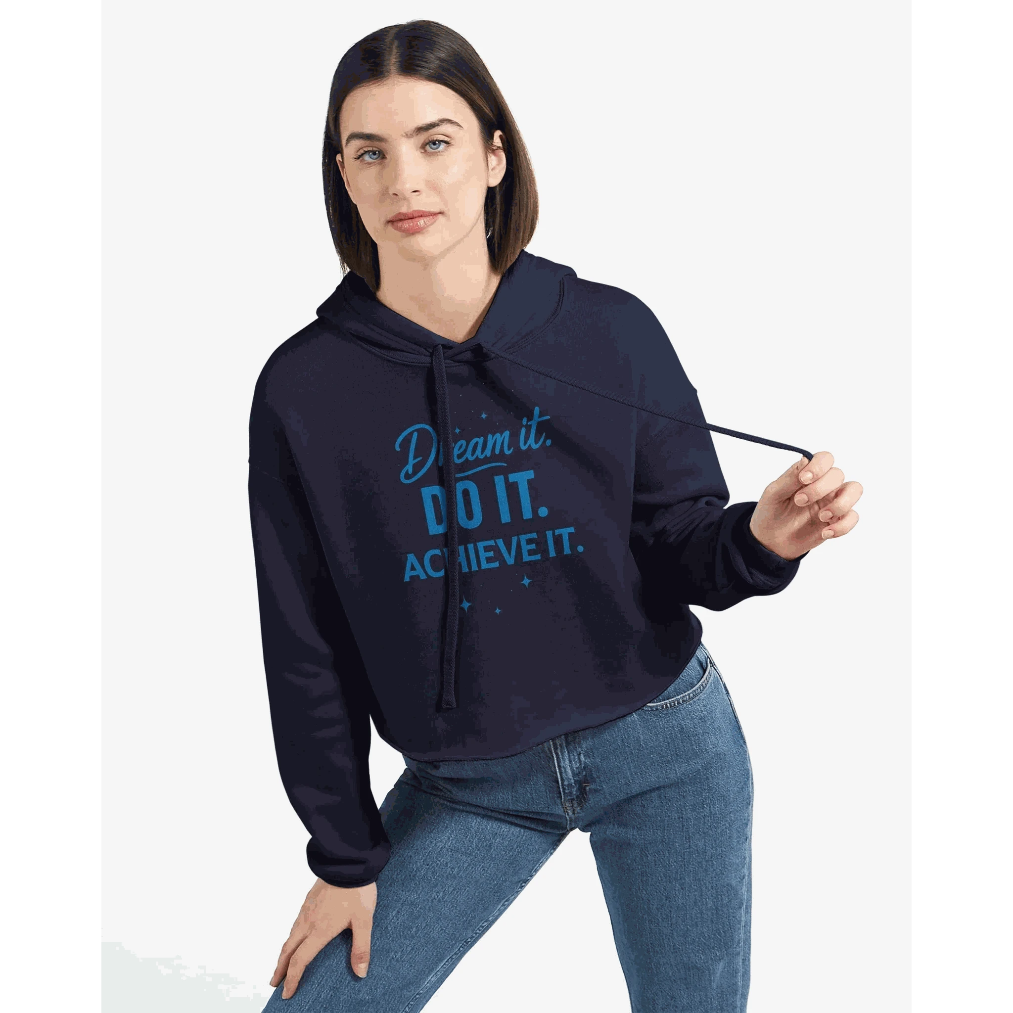 Woman wearing navy cropped motivational hoodie with "Dream it DO IT ACHIEVE IT" text and raw hem