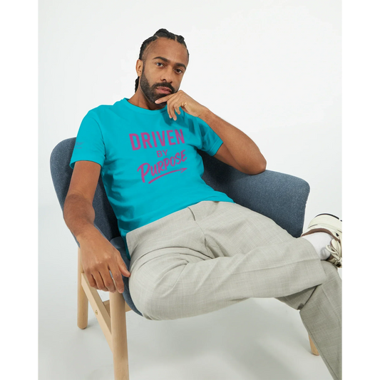 Man wearing a bright blue fitted t-shirt with "Driven by Purpose" motivational text sitting in a modern chair