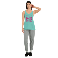 Women's flowy racerback tank top in teal with "Dream BIG Go Far" motivational text, paired with gray pants.
