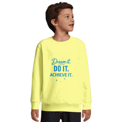 Child wearing yellow recycled kids sweatshirt with Dream It. Do It. Achieve It. motivational text