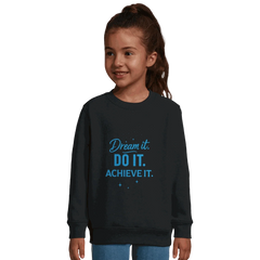 Child wearing black recycled kids sweatshirt with blue "Dream It. DO IT. ACHIEVE IT." motivational text